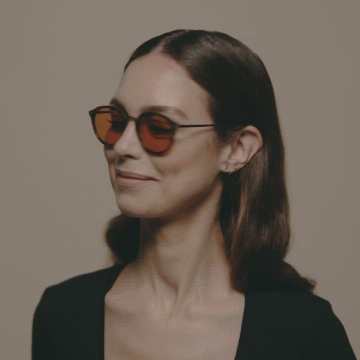 Load video: Tens Lane Evergreen / Matte Black Gunmetal Sunglasses Female Model Video